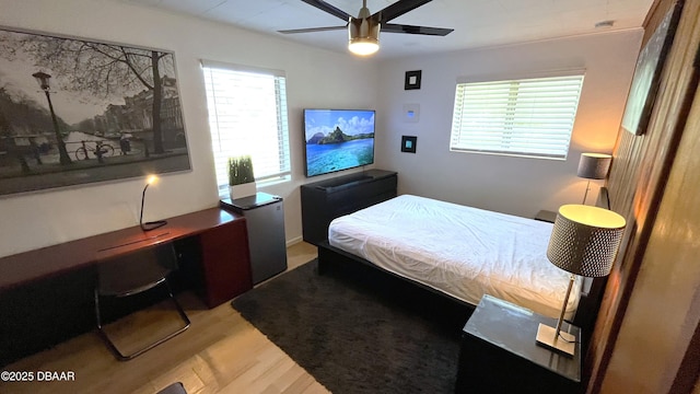 bedroom featuring ceiling fan and wood finished floors