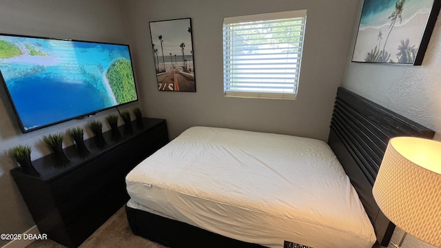 bedroom featuring a textured wall