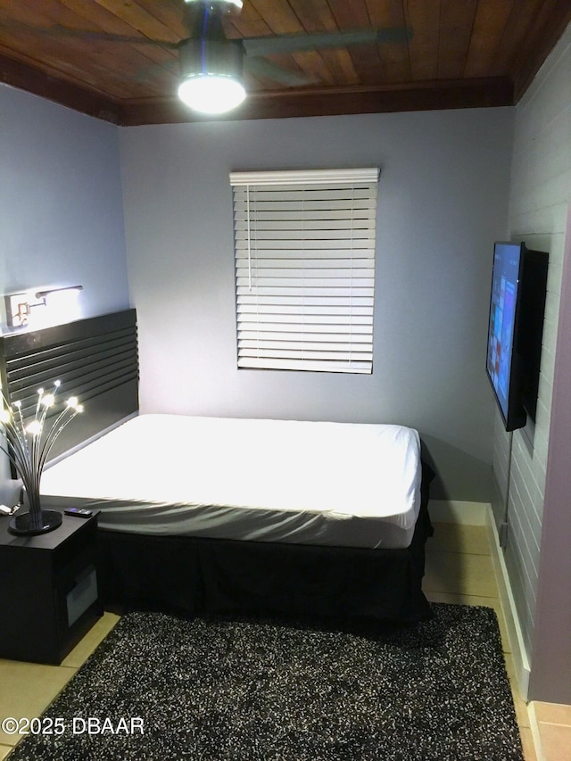 bedroom featuring wood ceiling and light tile patterned flooring