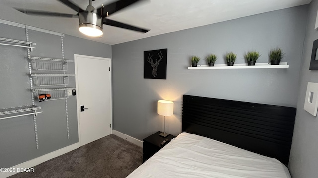 carpeted bedroom with baseboards and ceiling fan