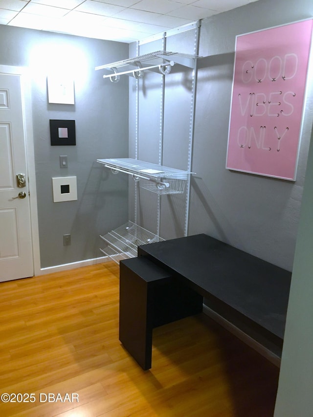 walk in closet featuring wood finished floors