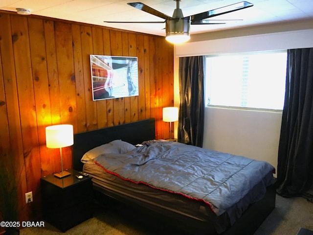 bedroom featuring wooden walls