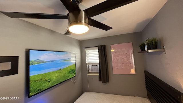 bedroom featuring cooling unit and ceiling fan