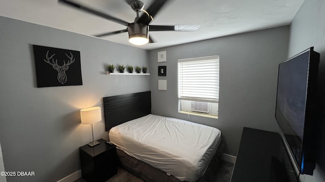 bedroom with cooling unit and ceiling fan