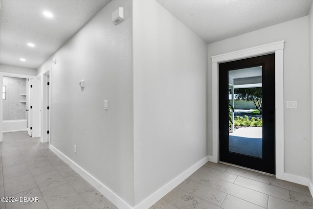 foyer featuring a textured ceiling