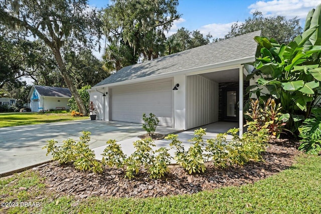 view of side of home with a garage