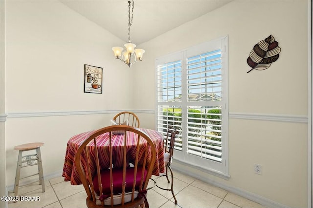 979 Leyburn Dr, Deltona, FL 32725 - tiled dining room featuring baseboards, a notable chandelier, and lofted ceiling