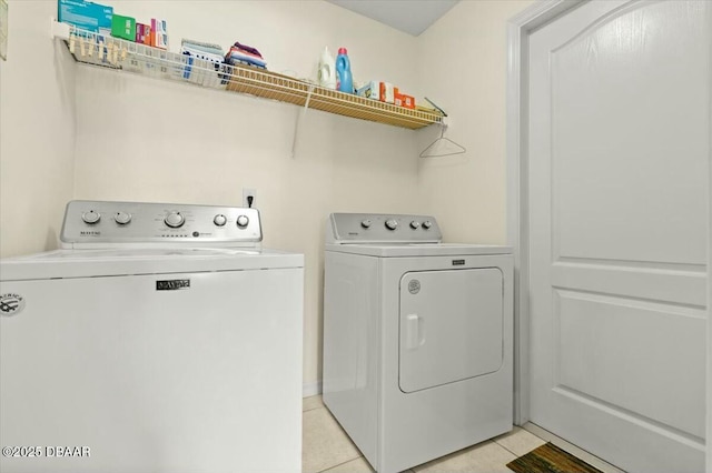 979 Leyburn Dr, Deltona, FL 32725 - washroom with light tile patterned flooring, washer and clothes dryer, and laundry area