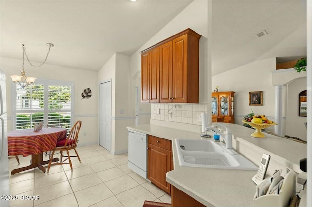 979 Leyburn Dr, Deltona, FL 32725 - kitchen with light countertops, vaulted ceiling, dishwasher, a sink, and a notable chandelier