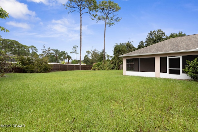 view of yard featuring fence