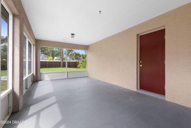 unfurnished sunroom featuring a healthy amount of sunlight