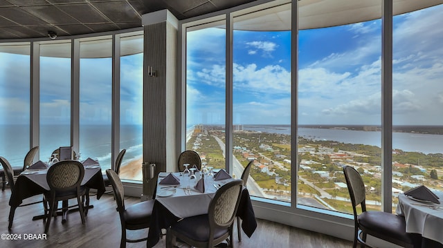 sunroom / solarium with a water view