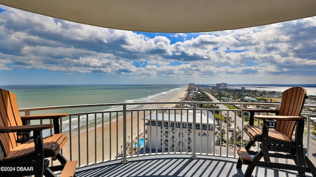 balcony with a view of the beach and a water view