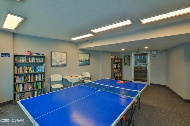 rec room with a textured ceiling and carpet floors