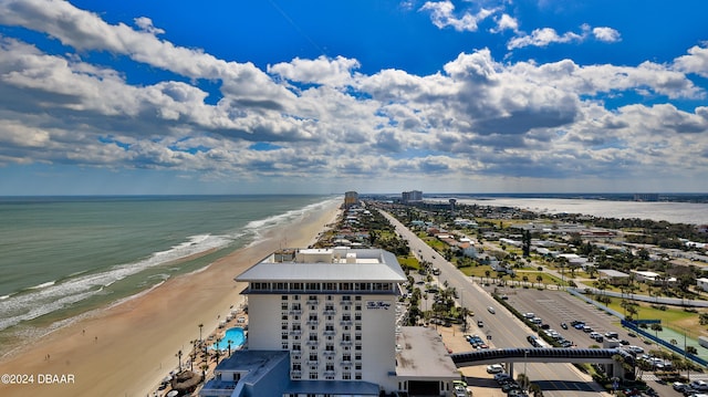 birds eye view of property featuring a view of the beach and a water view