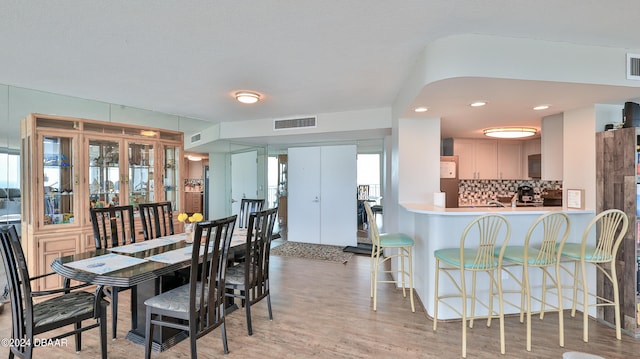 dining room with hardwood / wood-style flooring