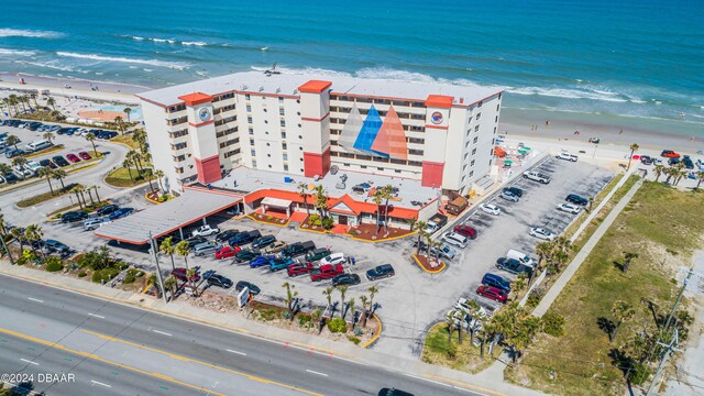 birds eye view of property featuring a view of the beach and a water view