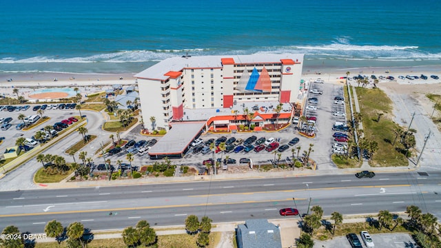 birds eye view of property with a view of the beach and a water view