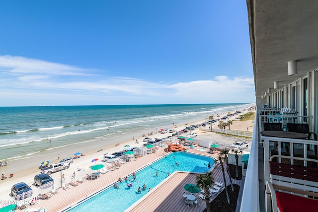 exterior space featuring a view of the beach and a water view