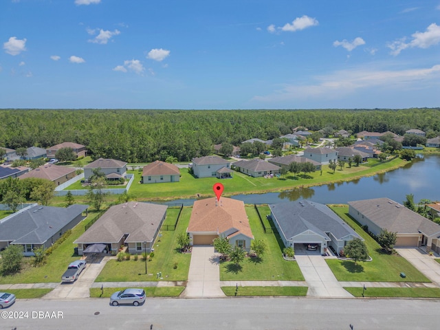 birds eye view of property with a water view