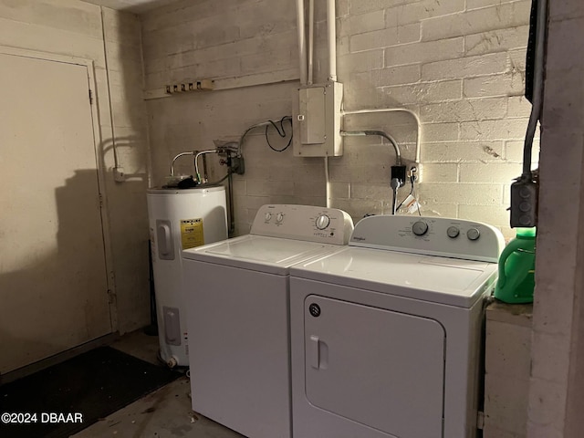 laundry room featuring electric water heater, washer and dryer, and electric panel