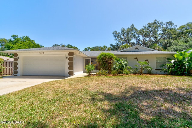 3119 Mango Tree Dr, Edgewater, FL 32141 - ranch-style house featuring an attached garage, driveway, and stucco siding