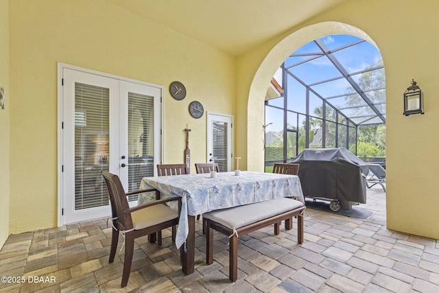 1207 Kaleen Dr, Ormond Beach, FL 32174 - view of patio / terrace with grilling area, glass enclosure, and outdoor dining area