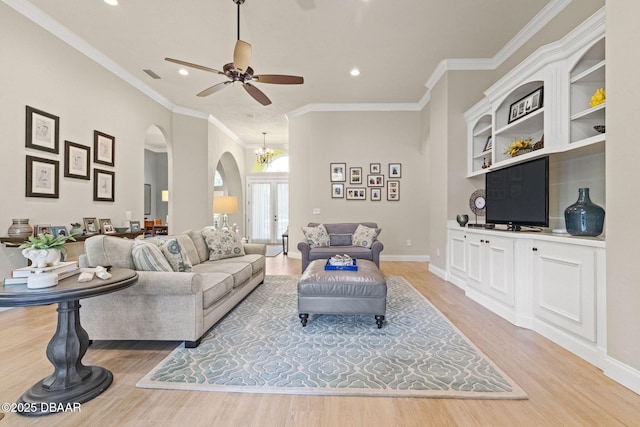 1207 Kaleen Dr, Ormond Beach, FL 32174 - living area featuring arched walkways, light wood-type flooring, a ceiling fan, recessed lighting, and crown molding