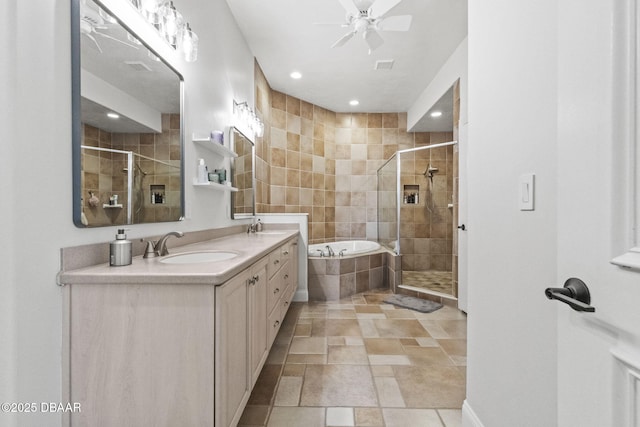1207 Kaleen Dr, Ormond Beach, FL 32174 - bathroom featuring a stall shower, double vanity, a garden tub, ceiling fan, and recessed lighting