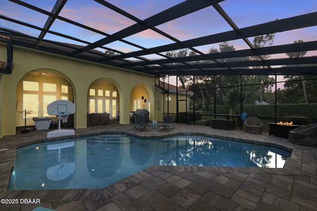 1207 Kaleen Dr, Ormond Beach, FL 32174 - swimming pool with an outdoor living space with a fire pit, a patio, and glass enclosure
