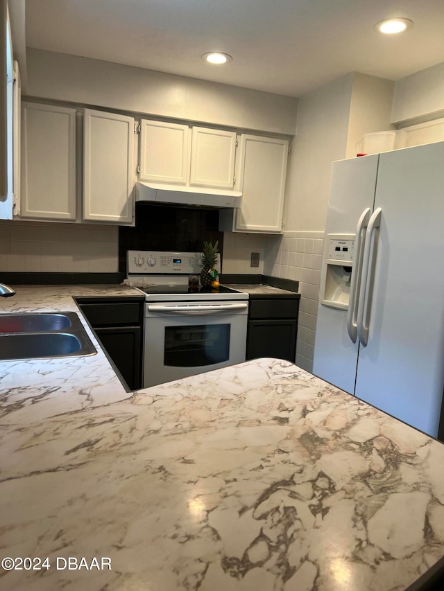 kitchen featuring white cabinetry, sink, white appliances, and backsplash