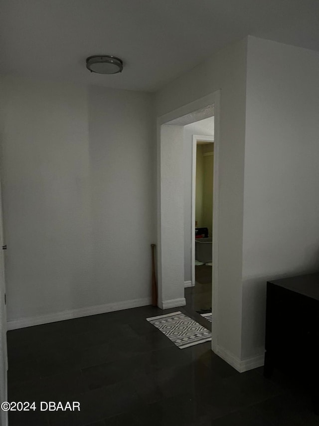 spare room featuring dark wood-type flooring