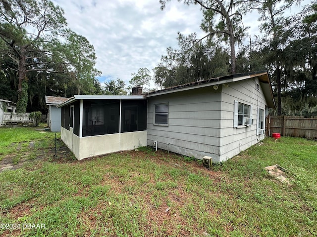 424 Stone Island Rd, Deltona, FL 32725 - back of property featuring a sunroom, a lawn, and cooling unit