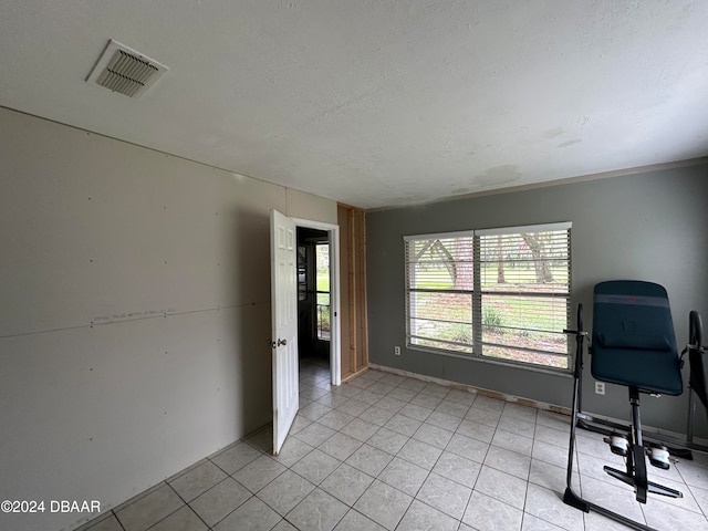 424 Stone Island Rd, Deltona, FL 32725 - home office with a textured ceiling and light tile patterned flooring