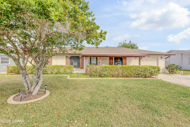 ranch-style house with a garage and a front lawn