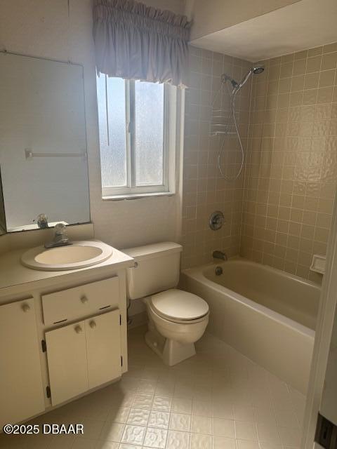 full bathroom with vanity, toilet, and tiled shower / bath