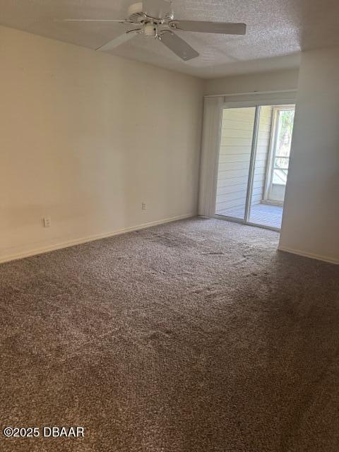 spare room with ceiling fan, carpet floors, and a textured ceiling