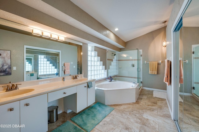 bathroom with vaulted ceiling, separate shower and tub, and vanity