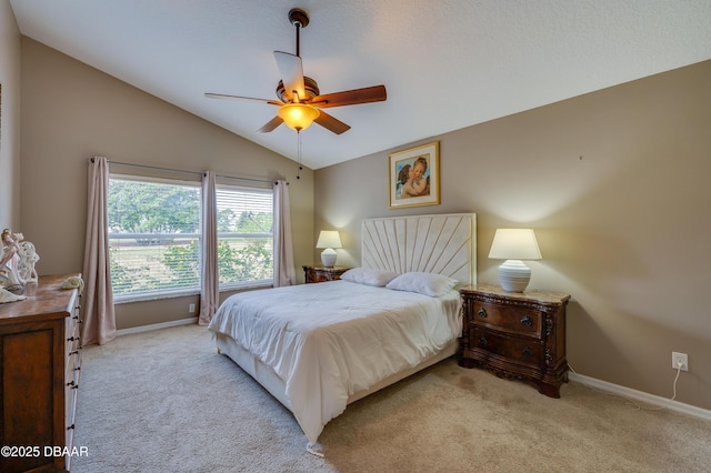 carpeted bedroom featuring ceiling fan and lofted ceiling