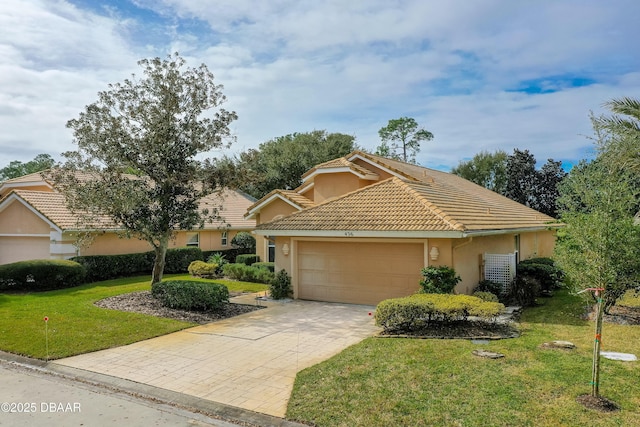 view of front facade with a garage and a front lawn