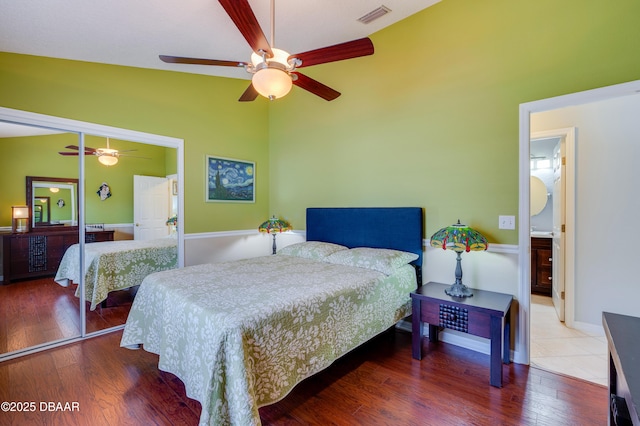 bedroom featuring a closet, lofted ceiling, hardwood / wood-style floors, and ceiling fan