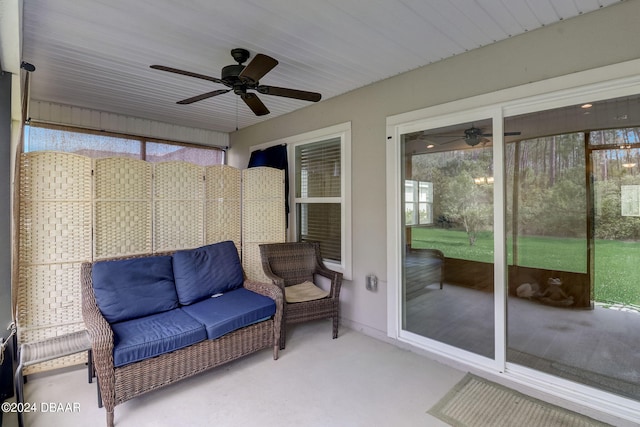 sunroom / solarium with plenty of natural light and ceiling fan