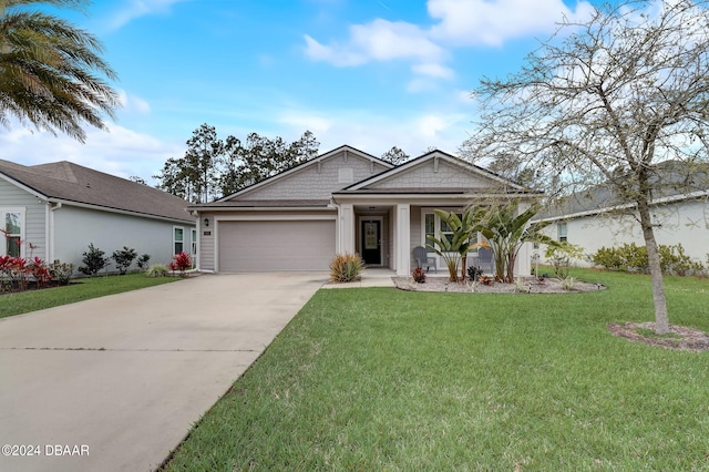 view of front of property featuring a garage and a front lawn