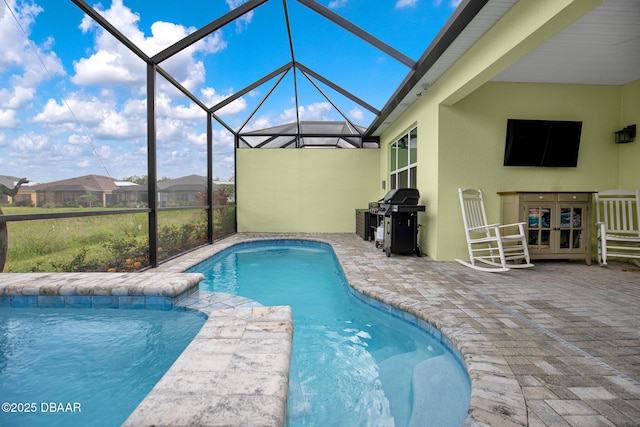 308 Low Tide Ln, Daytona Beach, FL 32124 - outdoor pool featuring a grill, a patio, french doors, and glass enclosure
