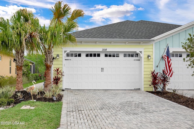 308 Low Tide Ln, Daytona Beach, FL 32124 - garage featuring decorative driveway
