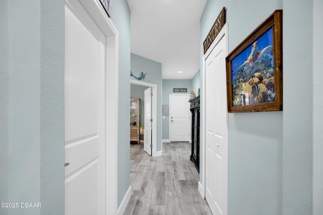 308 Low Tide Ln, Daytona Beach, FL 32124 - hall featuring baseboards and light wood-type flooring
