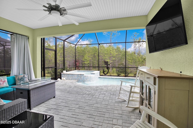 308 Low Tide Ln, Daytona Beach, FL 32124 - view of swimming pool featuring ceiling fan, a pool with connected hot tub, a patio, and a lanai