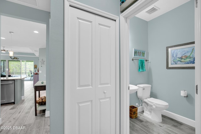 308 Low Tide Ln, Daytona Beach, FL 32124 - bathroom with a closet, wood finished floors, and recessed lighting
