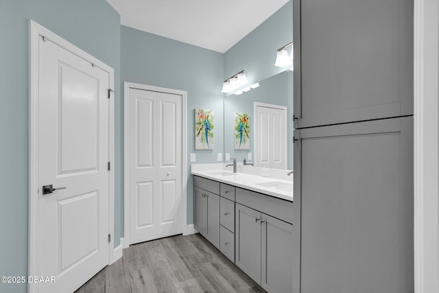 308 Low Tide Ln, Daytona Beach, FL 32124 - full bathroom with double vanity and wood finished floors