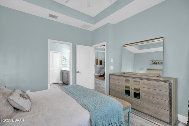 308 Low Tide Ln, Daytona Beach, FL 32124 - bedroom with wood finished floors and ensuite bath